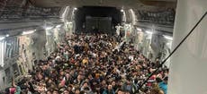 Shocking photos show 640 Afghans crammed into fleeing US Air Force plane