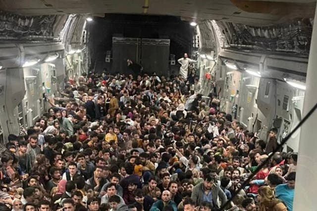 <p>More than 600 Afghans squeeze onto a US evacuation flight out of Kabul on Sunday, 15 August, 2021</p>