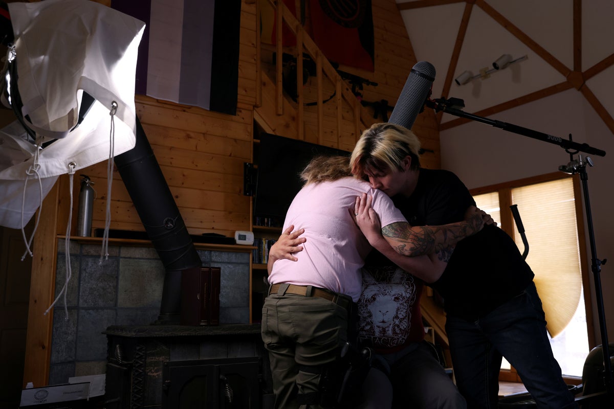 Penny Logue, 40, and Ash Kreis, 33, hug Bonnie Nelson, 34, after Nelson gave a particularly difficult on camera interview about Nelson's family to Kreis, who is doing a documentary about the ranch