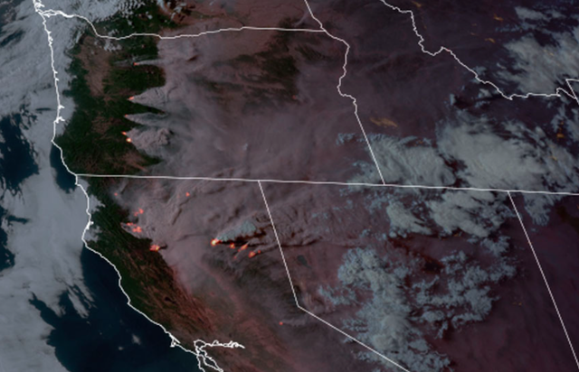 <p>Satellite image shows Oregon and California wildfires spreading east.  </p>