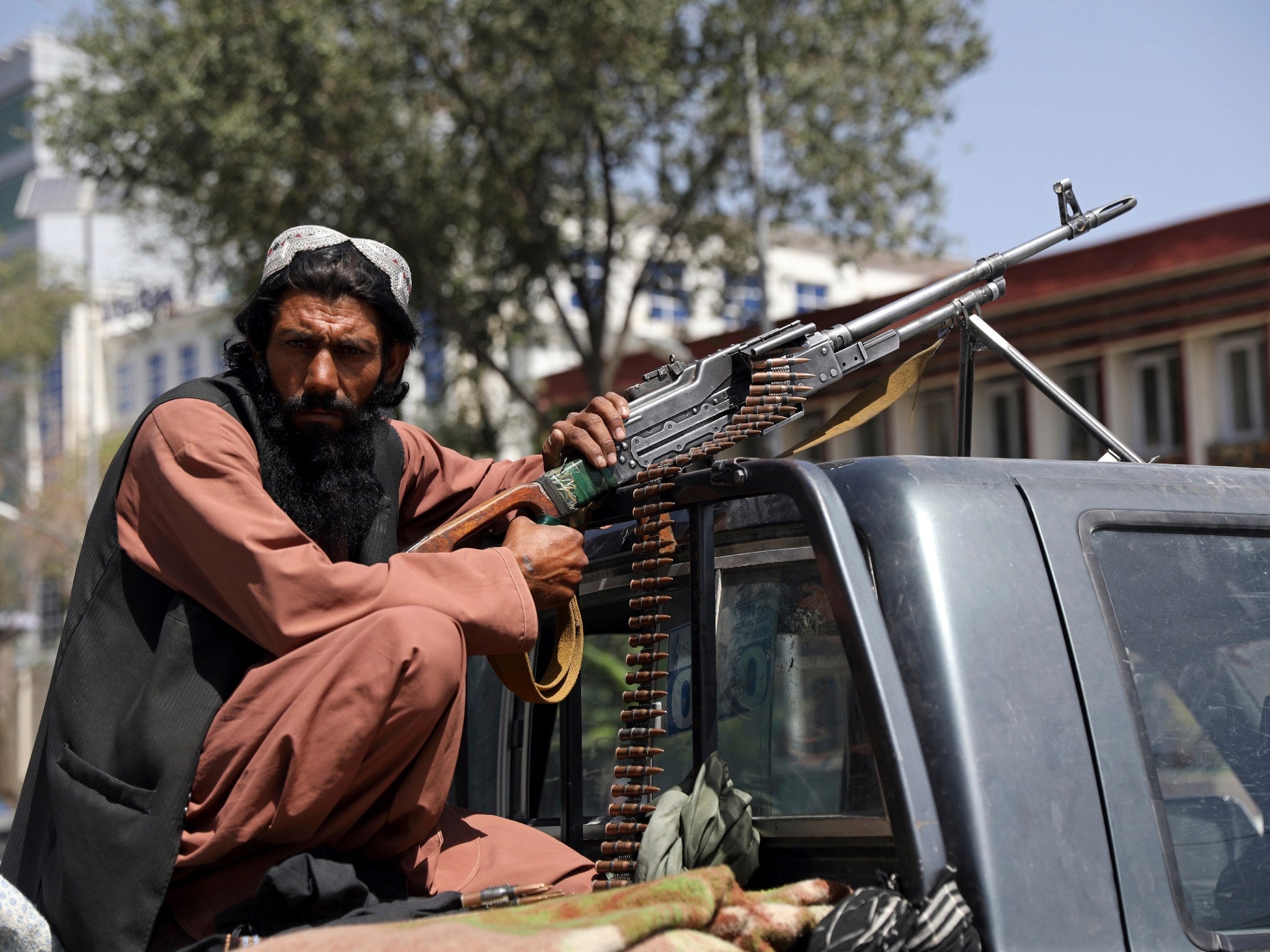 A Taliban fighter outside the presidential palace in Kabul