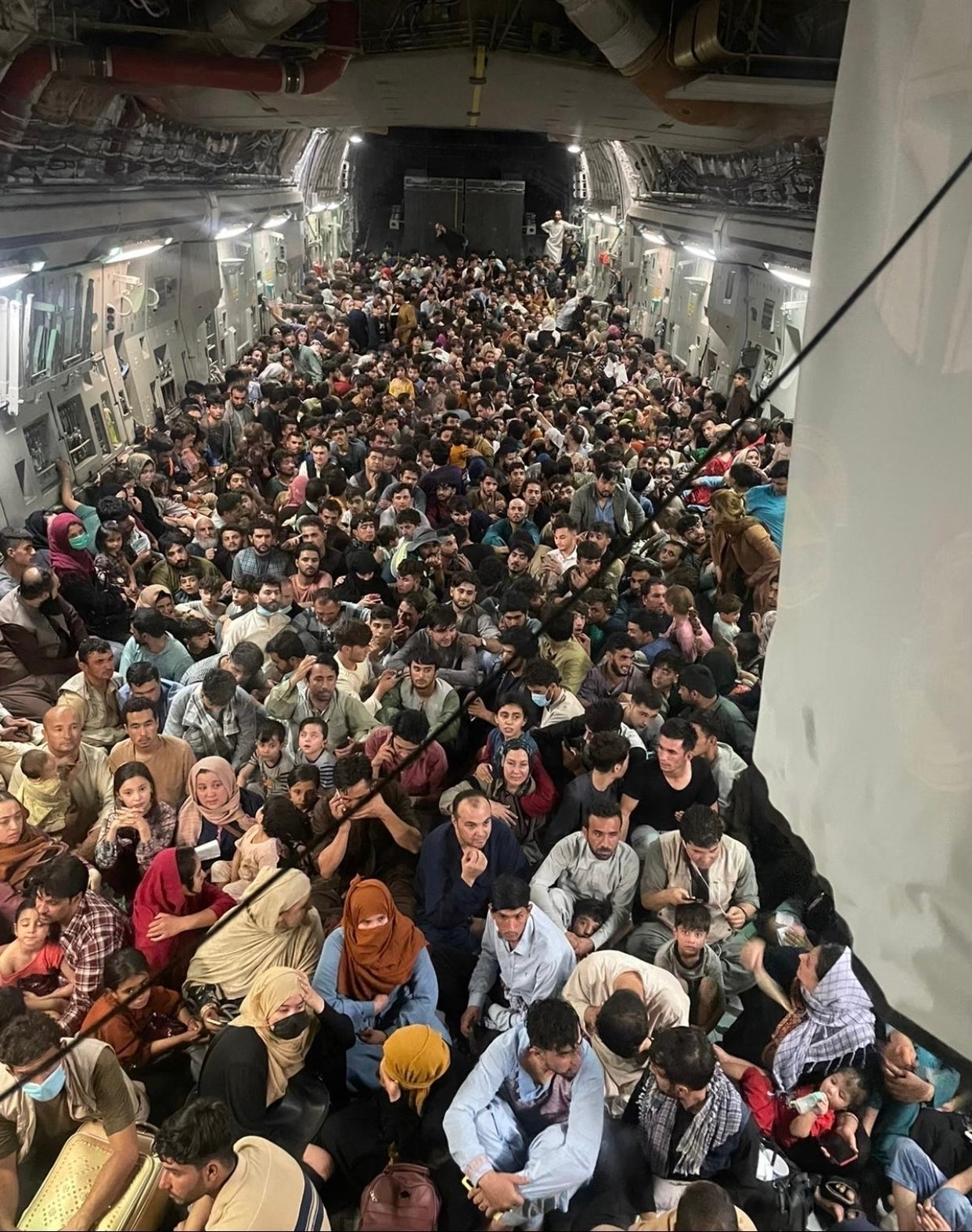 Image is thought to show almost 700 people rammed into a C-17 Globemaster III