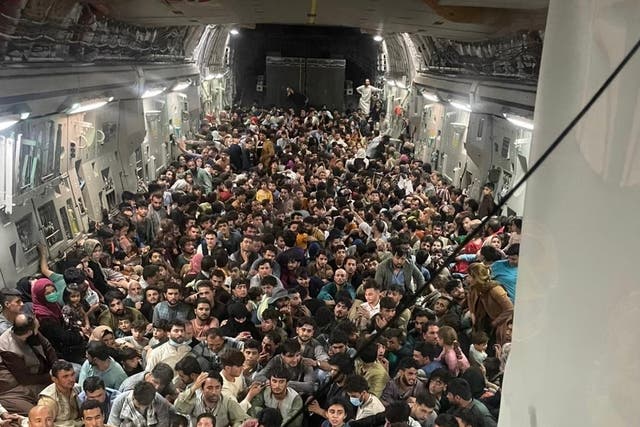 <p>Image is thought to show almost 700 people rammed into a C-17 Globemaster III</p>