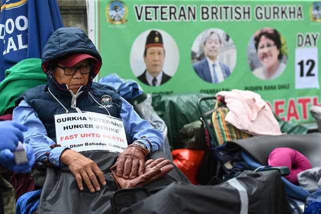 <p>Former British Gurkha soldier Dhan Gurung on hunger strike outside Downing Street</p>