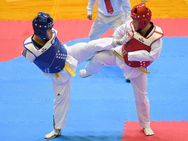 <p>Shota Abe and Kazuki Ishihara compete during the para kyorugi at the Japan Taekwondo Championships at Chiba Port Arena on 16 February 2019</p>
