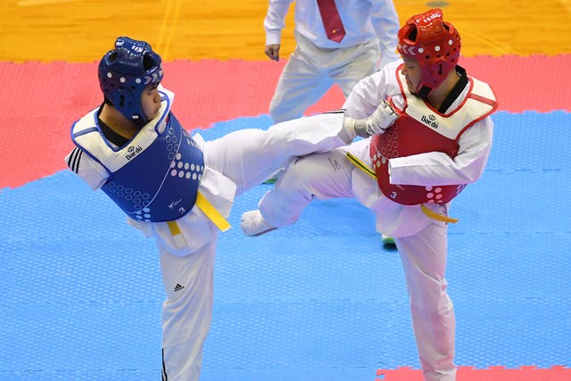 <p>Shota Abe and Kazuki Ishihara compete during the para kyorugi at the Japan Taekwondo Championships at Chiba Port Arena on 16 February 2019</p>
