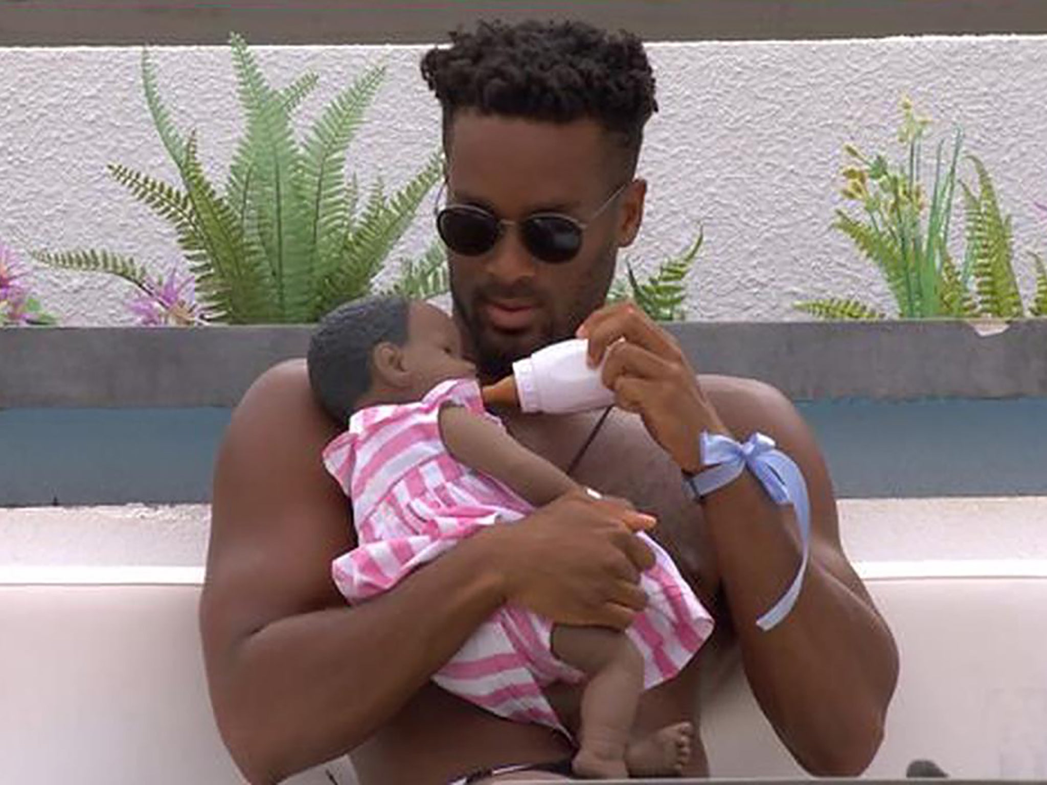 Teddy cradles his battery-powered newborn on ‘Love Island'