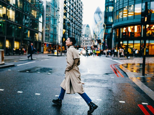 <p>A person walks through London</p>