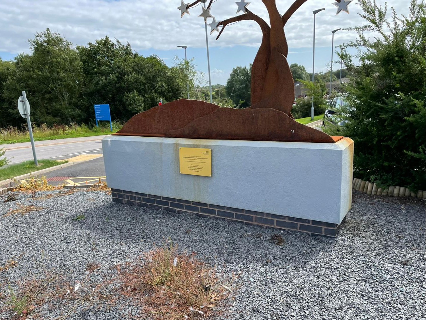 The rusted and overgrown memorial to 11 babies and one mother who died at Furness General Hospital, outside the £12 million South Lakes Birth Centre