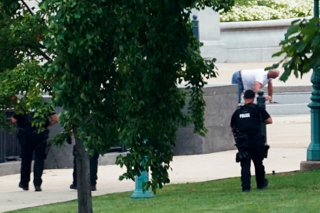 <p>A person is apprehended after being in a pickup truck parked on the sidewalk in front of the Library of Congress' Thomas Jefferson Building. The man was identified as Floyd Ray Roseberry, 49, of Grover, North Carolina, according to two people briefed on the matter. (AP Photo/Alex Brandon)</p>