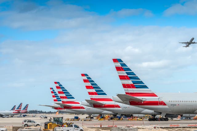 <p>America Airlines planes waiting for passengers at Miami International Airport.</p>