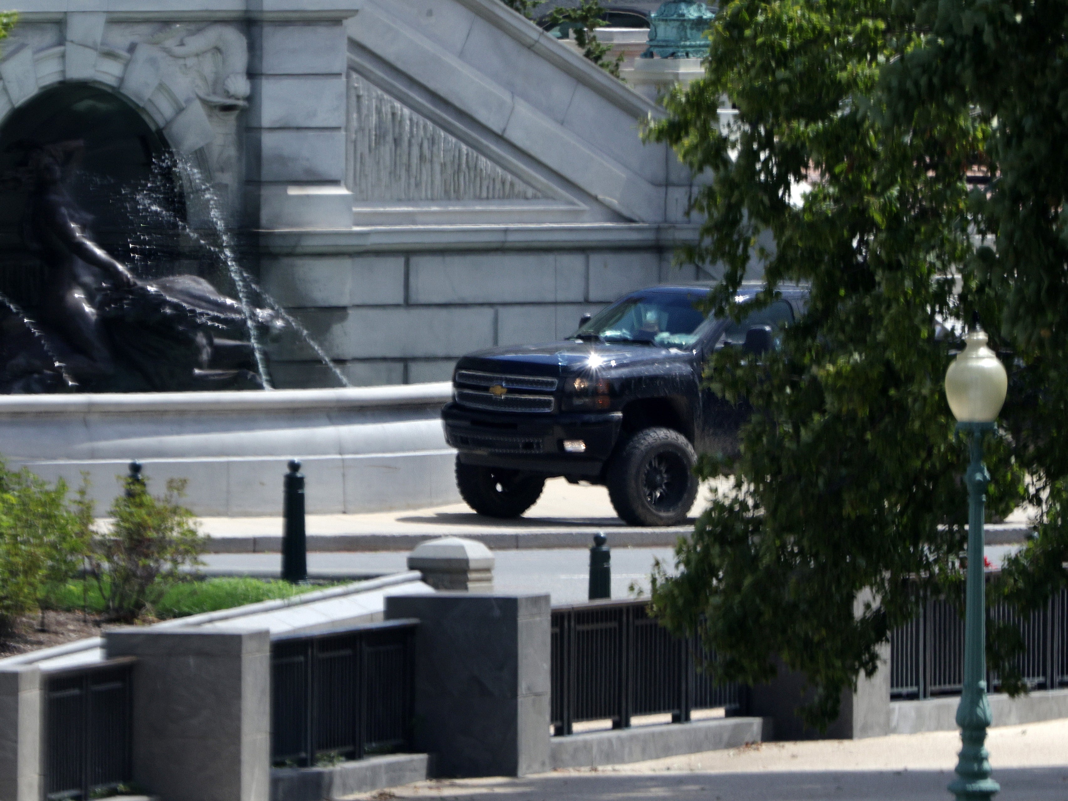 A pickup truck sits outside the Library of Congress, directly across from the U.S. Capitol, on Capitol Hill August 19, 2021 in Washington, DC. A man drove a pickup truck onto the sidewalk outside the Library this morning telling police officers that he had a bomb