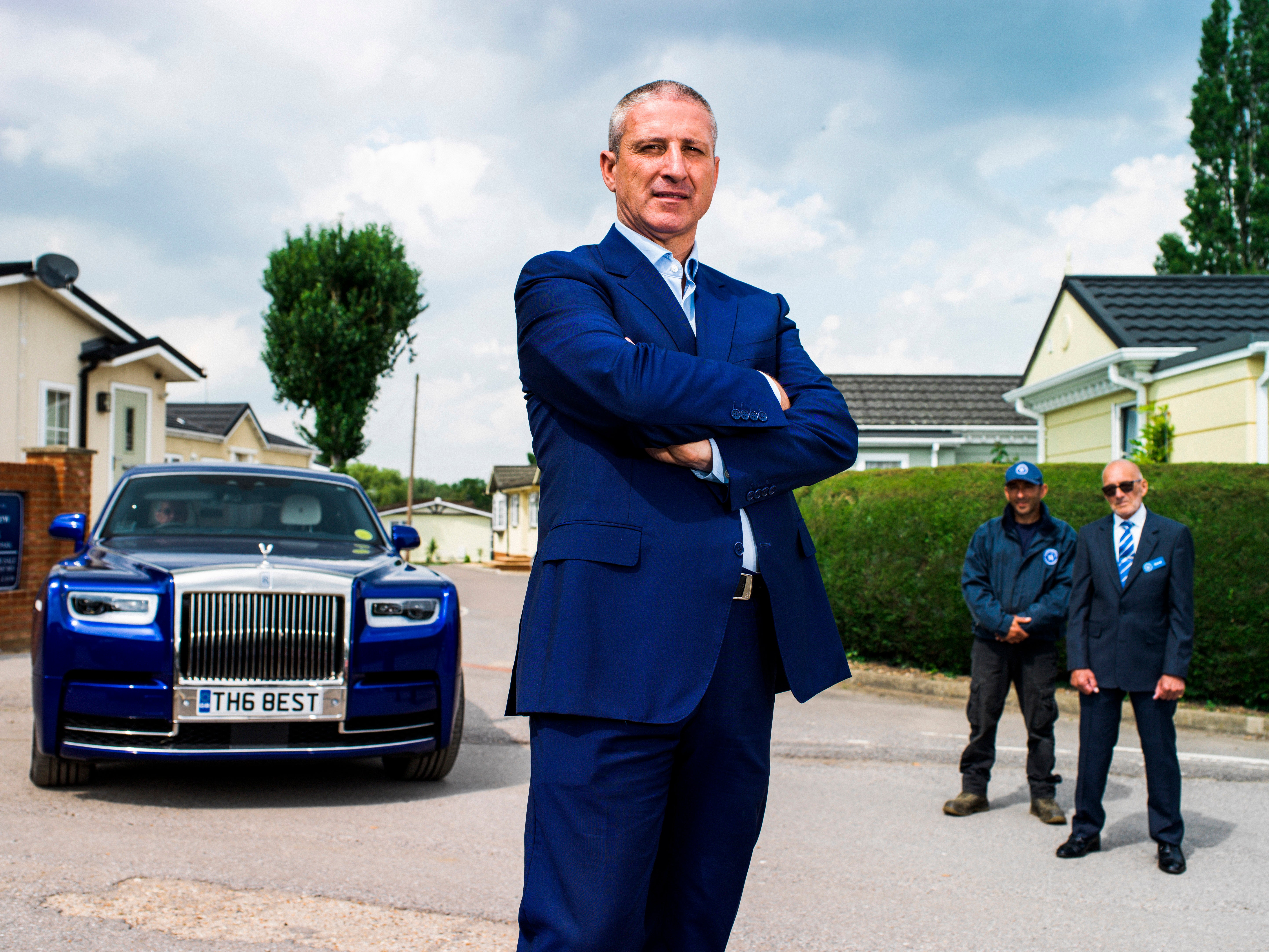 Self-made millionaire Alfie Best at Wyldecrest Parks in Essex with his Rolls-Royce and park workers
