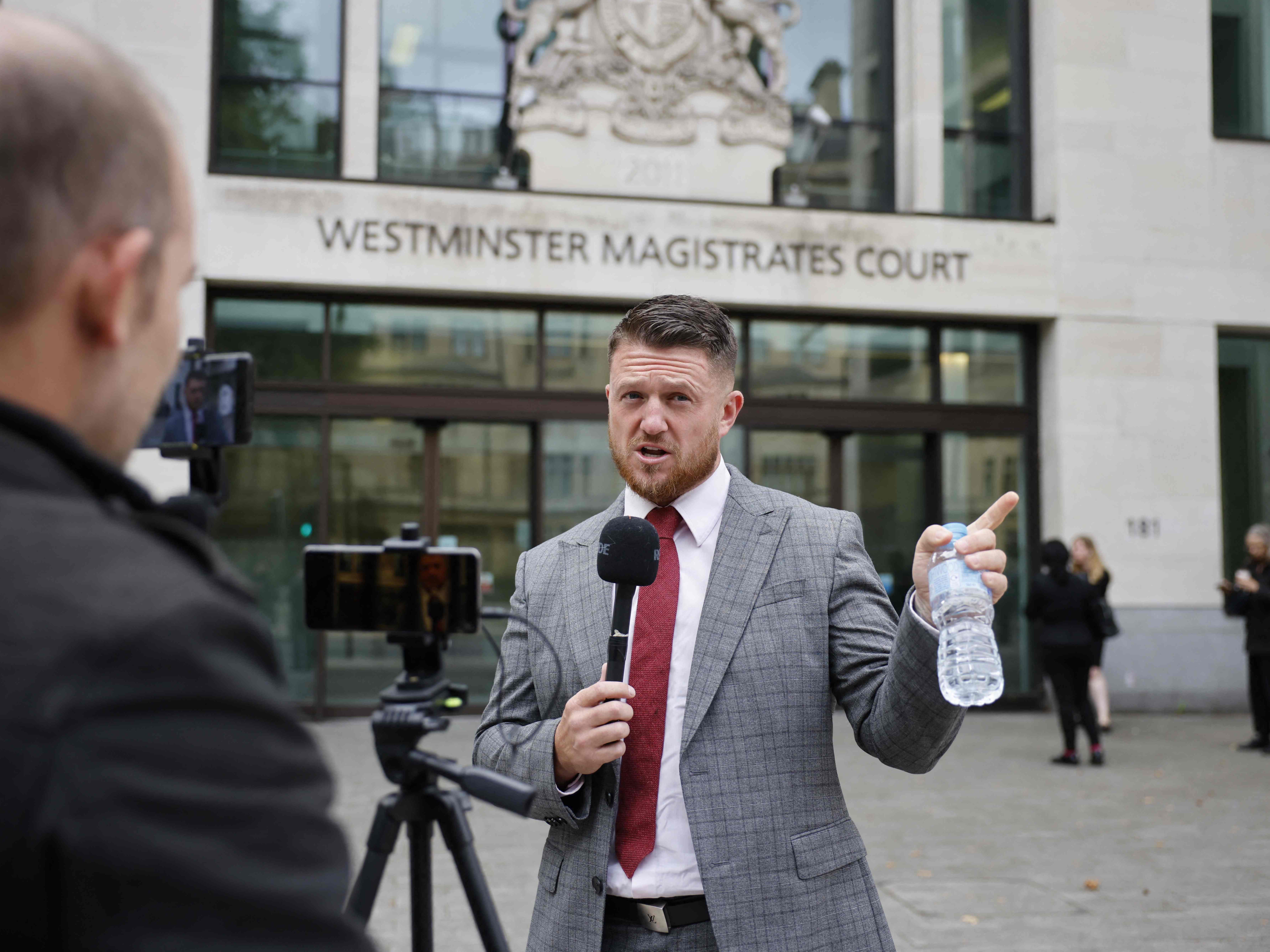 English Defence League founder Tommy Robinson, whose real name is Stephen Yaxley-Lennon, speaks to media outside Westminster Magistrates’ Court
