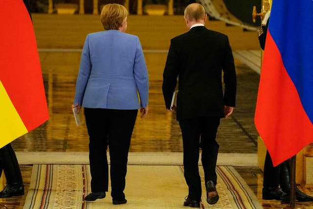 <p>Goodbye to all that: German chancellor Angela Merkel and Russian president Vladimir Putin leave a joint news conference following their talks at the Kremlin in Moscow</p>