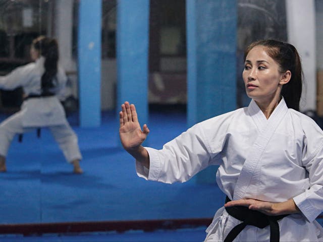 <p>Meena Asadi fled Afghanistan years before and now teaches karate to refugees in Indonesia</p>