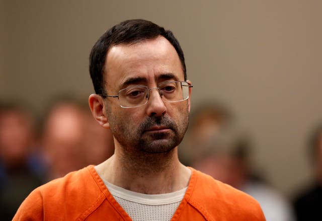 <p>Former Michigan State University and USA Gymnastics doctor Larry Nassar appears at Ingham County Circuit Court on November 22, 2017 in Lansing, Michigan.</p>