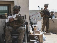 Photo of US marine calming infant during Afghanistan evacuation goes viral