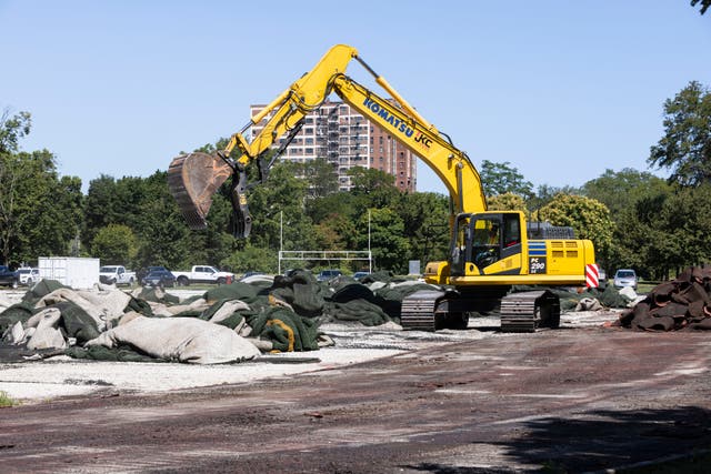 <p>Construction crews tear up the turf field and track in Jackson Park starting construction on The Barack Obama Presidential Center in Chicago on Monday 16 August 16 2021.</p>