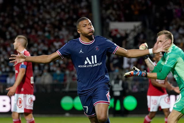 Kylian Mbappe celebrates after scoring for Paris St Germain in their 4-2 Ligue 1 win at Brest (Daniel Cole/AP)