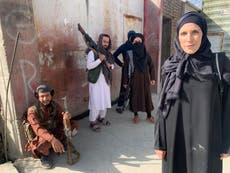 CNN correspondent gives Afghan woman her scarf as blanket before flying out of Kabul