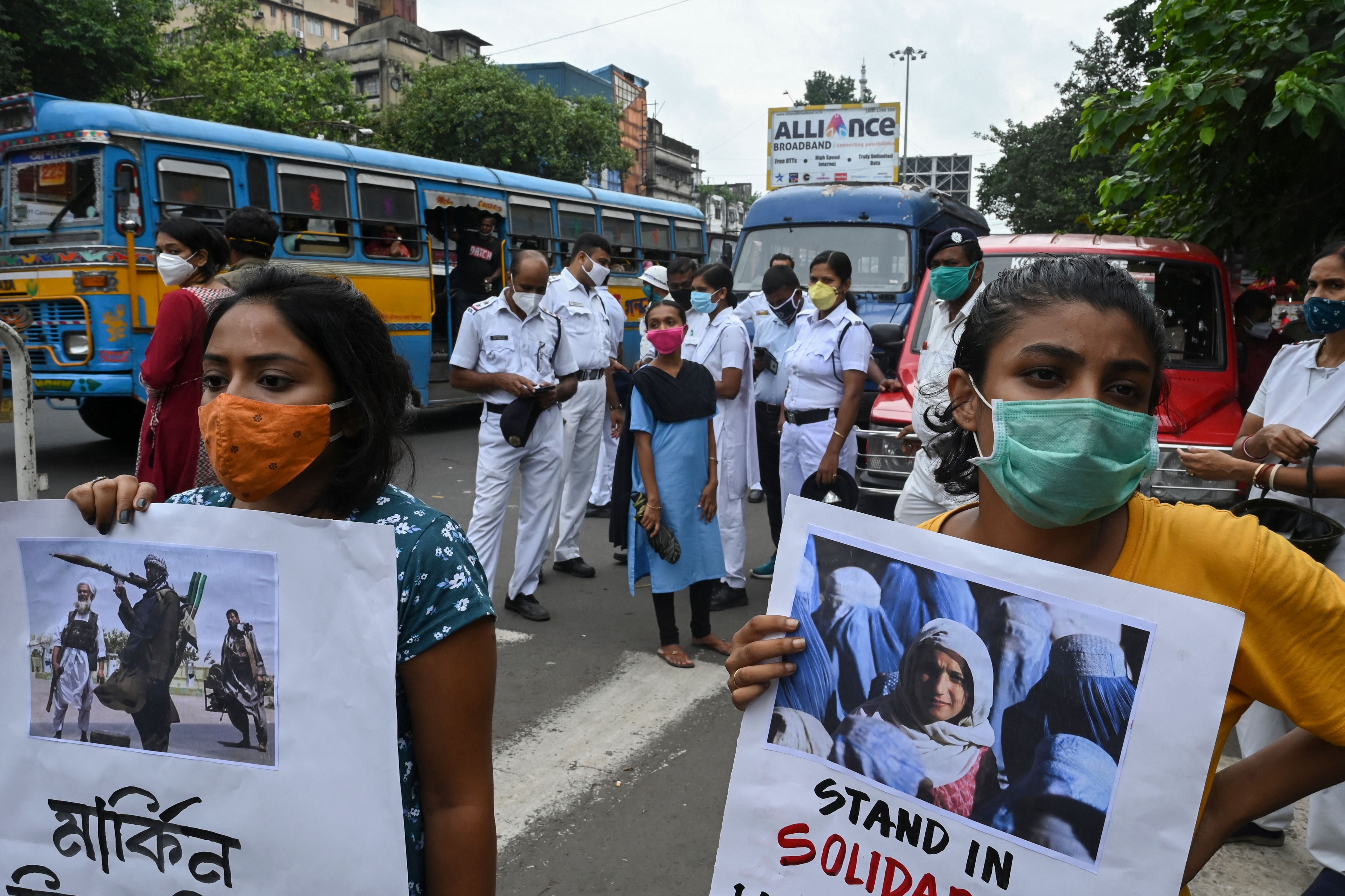 Students shout slogans against the Taliban takeover of Afghanistan as they take part in a demonstration held in Kolkata