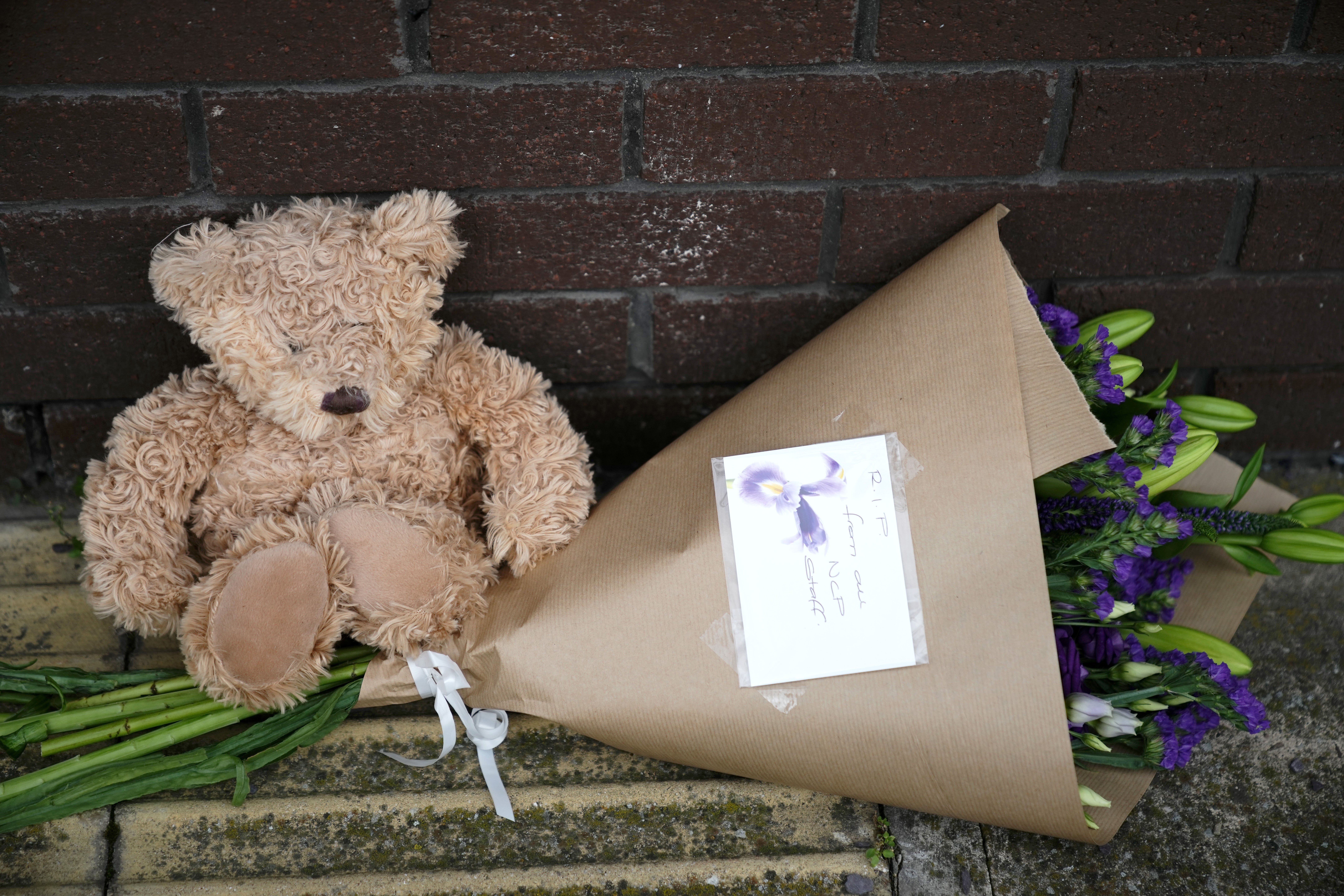 Tributes lay outside the OYO Sheffield Metropolitan Hotel where Mohammed Munib Majeedi fell from a ninth-floor window