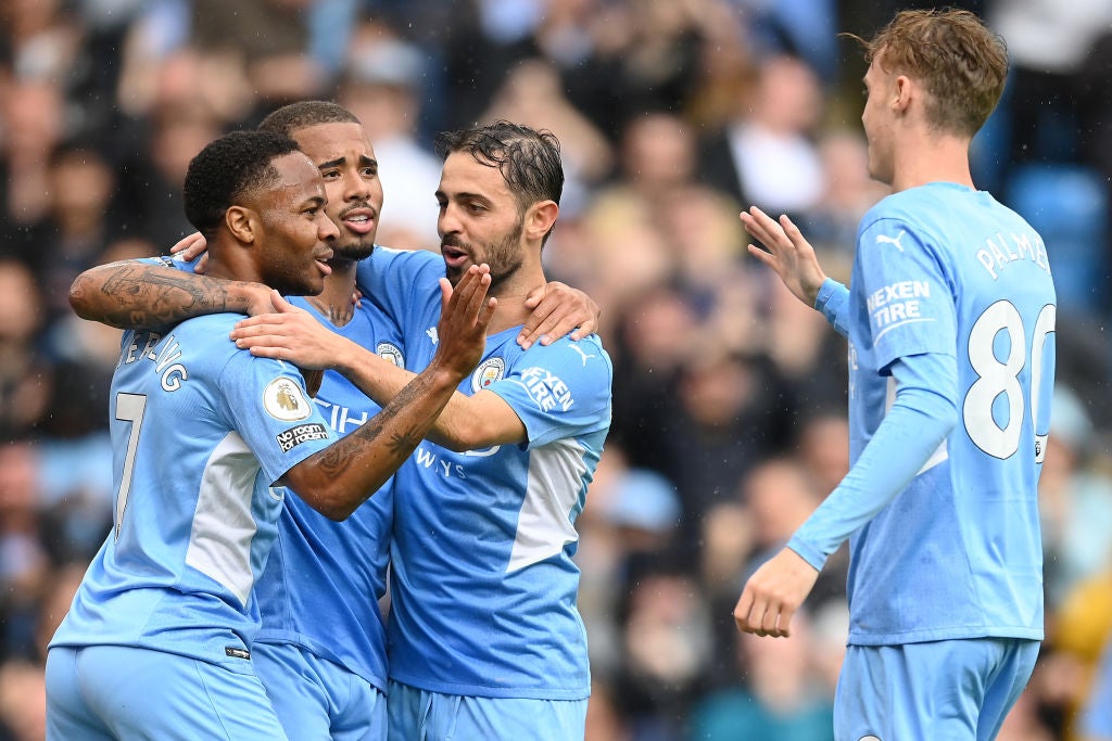 Raheem Sterling celebrates with Gabriel Jesus and Bernardo Silva after scoring City’s fourth goal