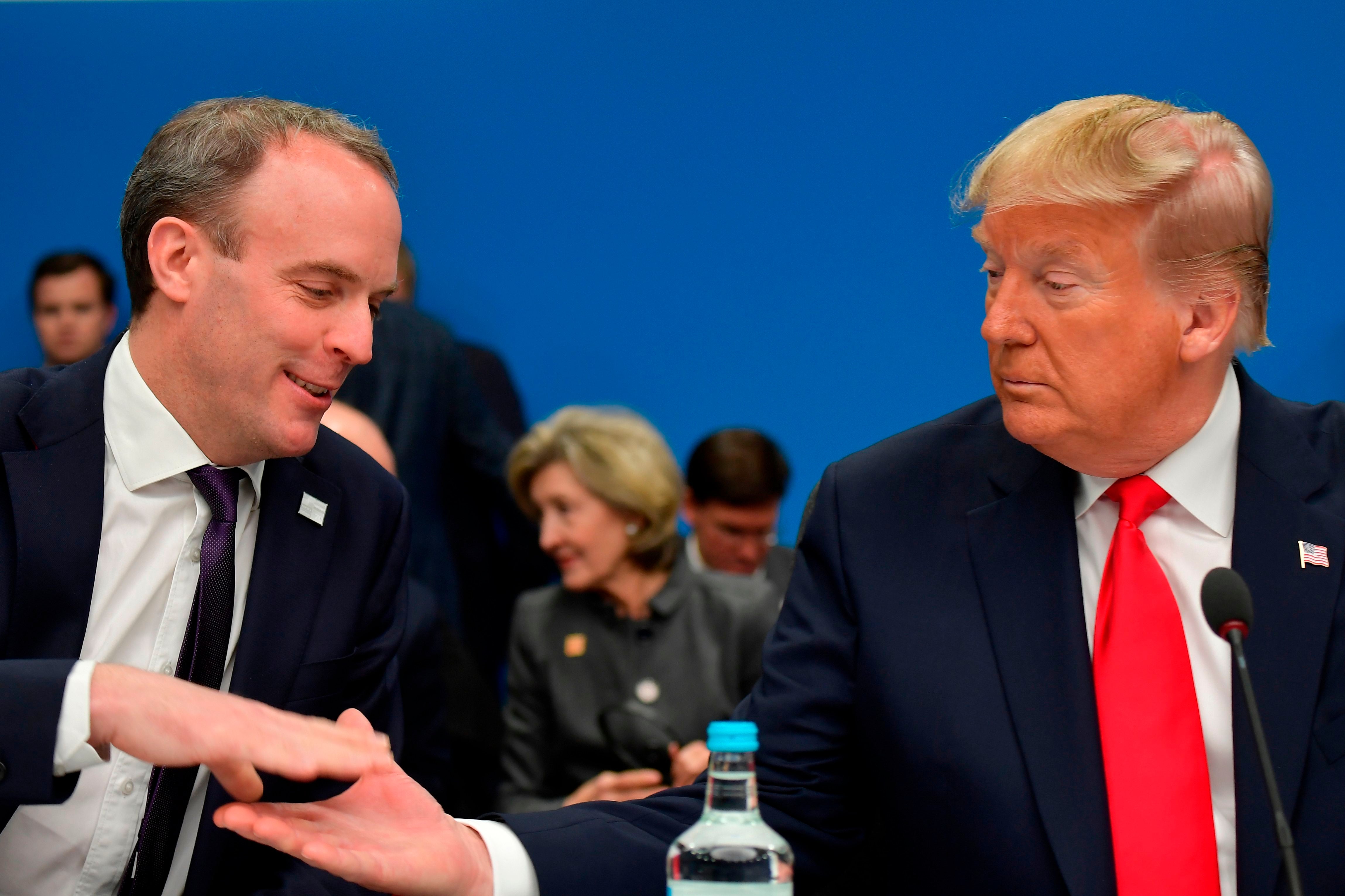 Raab shakes hands with President Trump in 2019