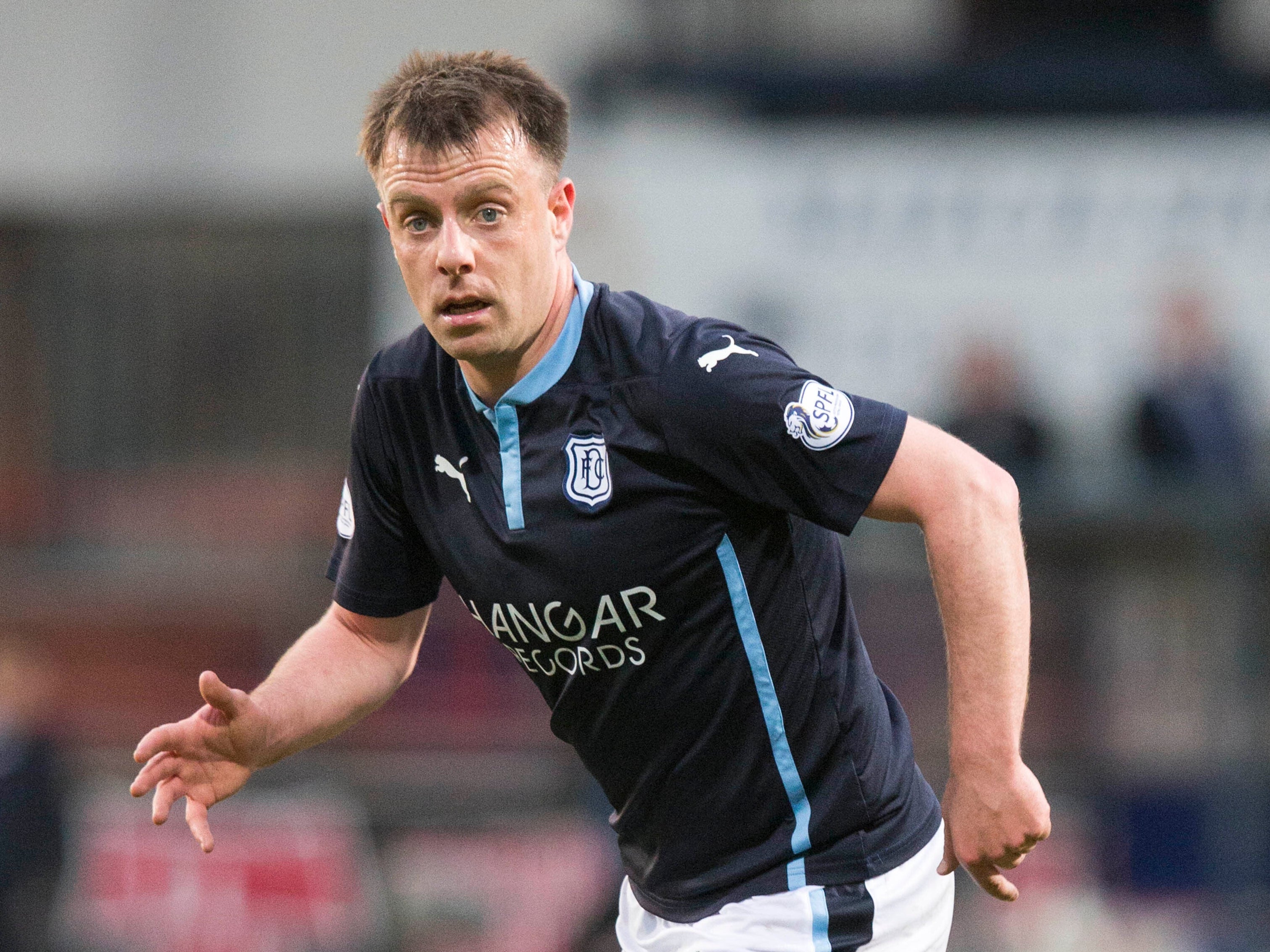 Paul McGowan headed a late equaliser for Dundee against Hibernian (Jeff Holmes/PA Images).