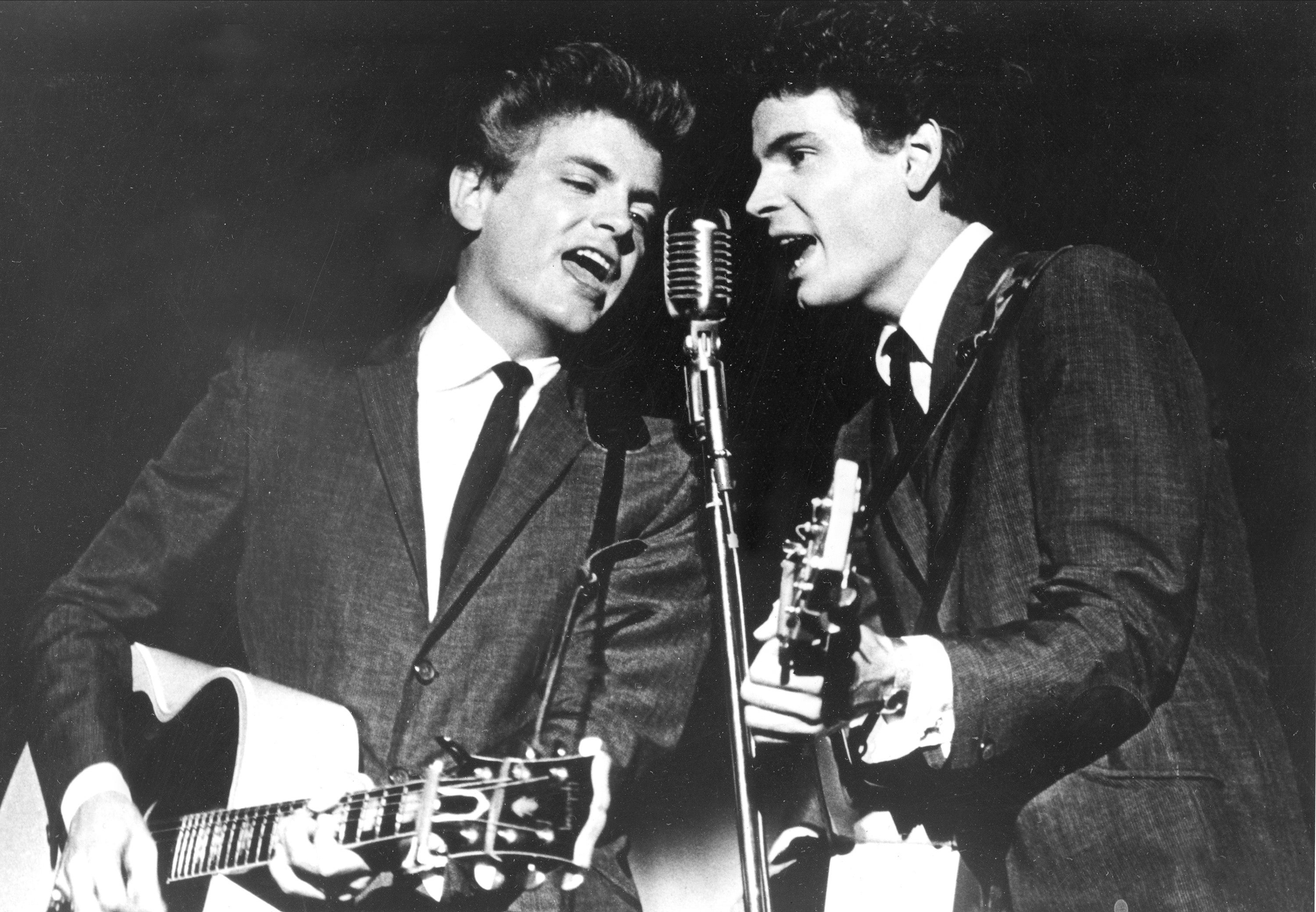 <p>The Everly Brothers, Phil, left, and Don, perform on stage in 1964 </p>
