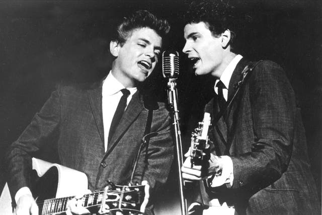 <p>The Everly Brothers, Phil, left, and Don, perform on stage in 1964 </p>