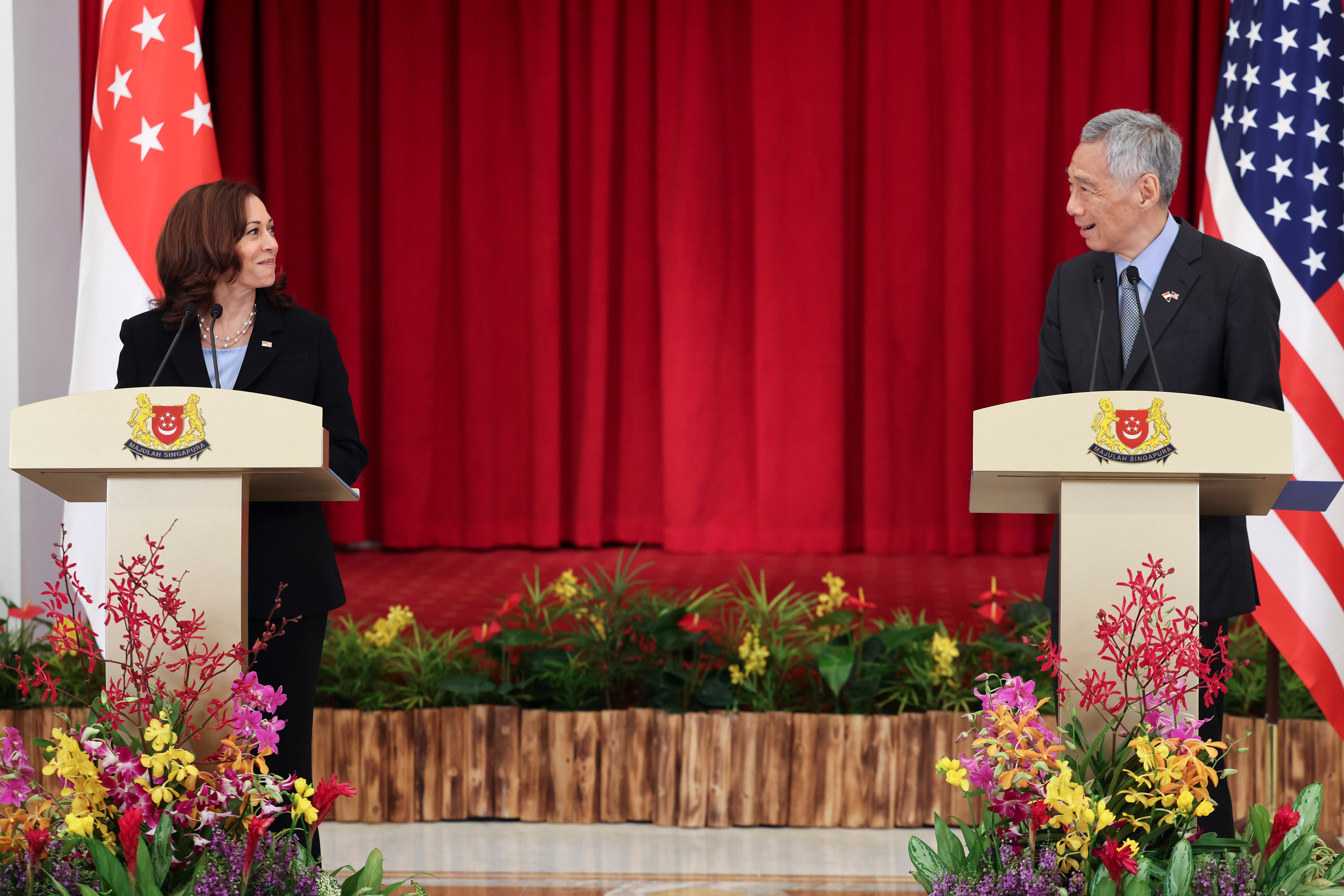 US vice president Kamala Harris, left, and Singapore's Prime Minister Lee Hsien Loong hold a joint news conference in Singapore Monday, 23 August 2021