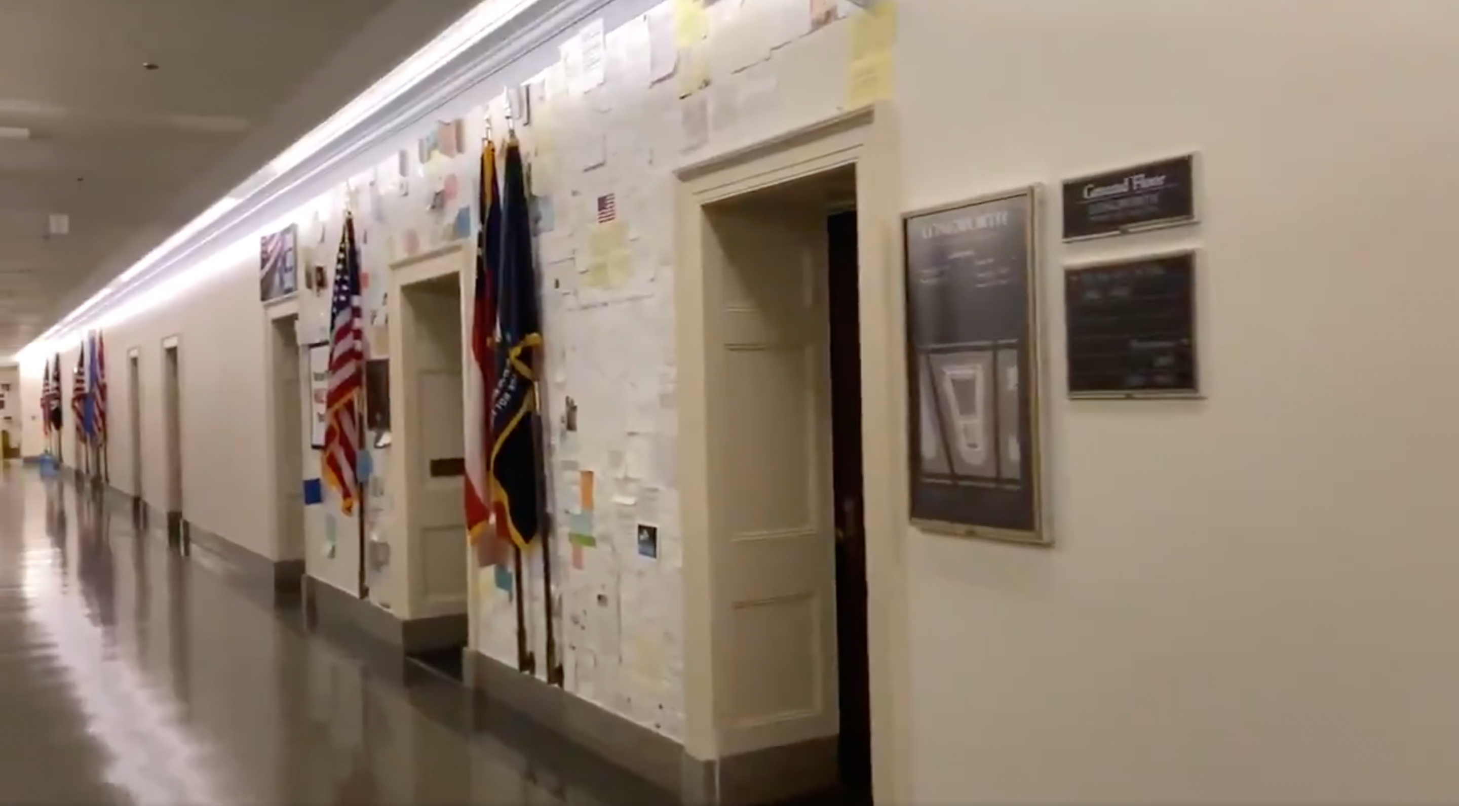 <p>A screengrab of the wall of messages stuck on the walls outside Rep. Marjorie Taylor Greene’s congressional office. </p>