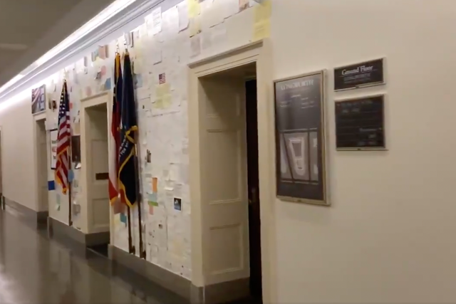 <p>A screengrab of the wall of messages stuck on the walls outside Rep. Marjorie Taylor Greene’s congressional office. </p>