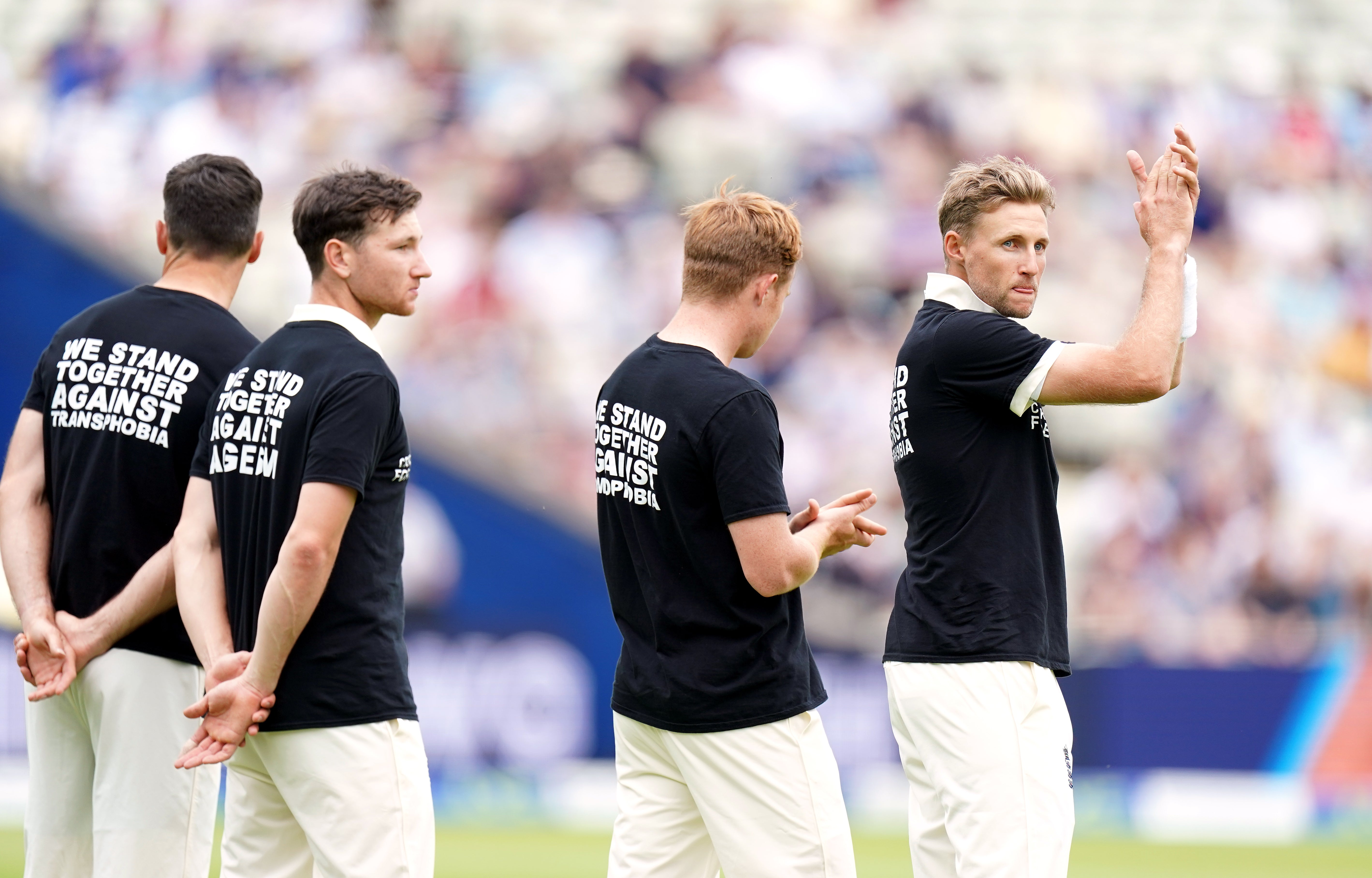 England captain Joe Root (pictured, right, campaigning against discrimination) says the pain of former team-mate Azeem Rafiq is ‘hard to see’ (Mike Egerton/PA Images).