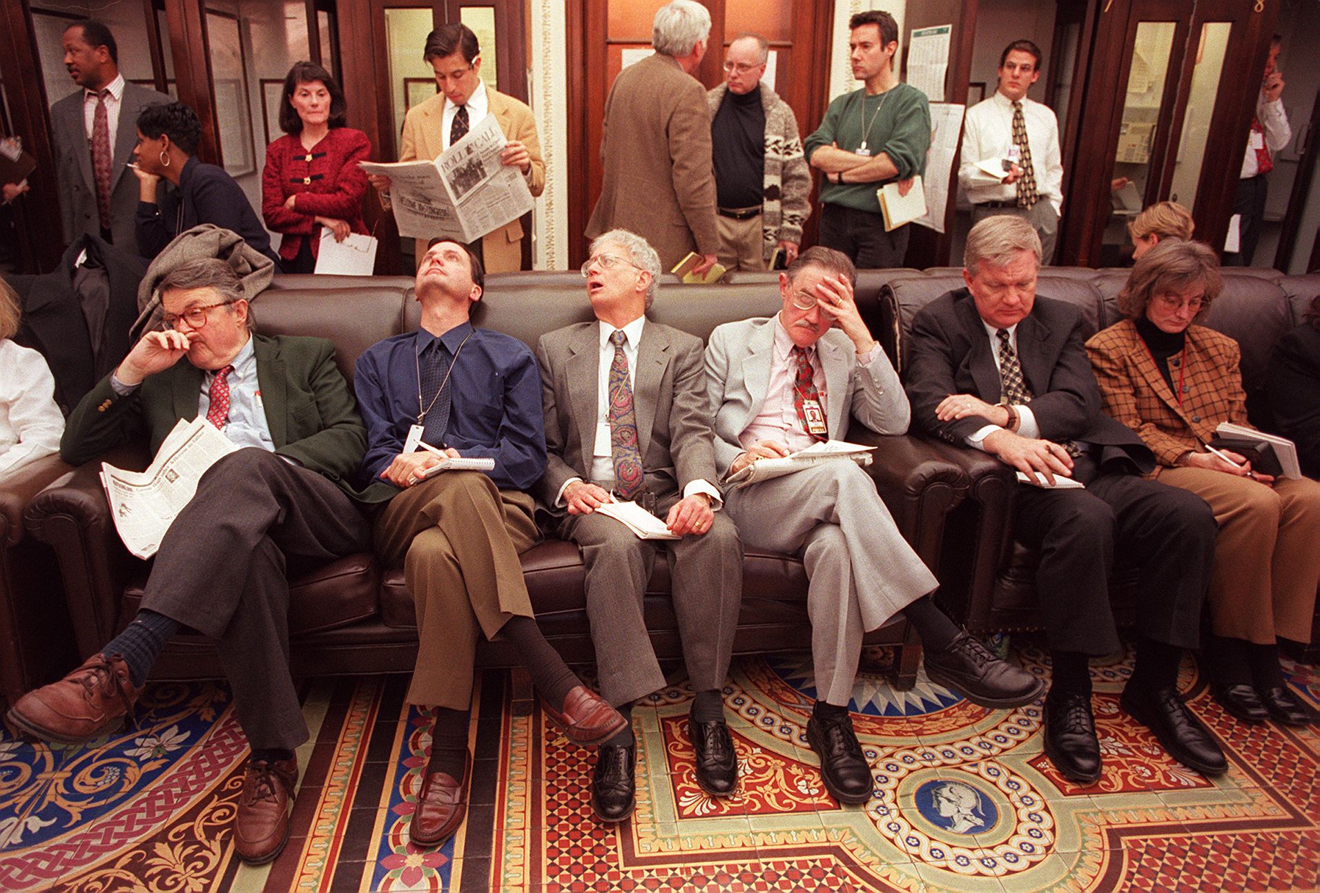 Members of the press wait outside the Senate chamber as the impeachment trial of US President Bill Clinton begins on 7 January 1999 on Capitol Hill