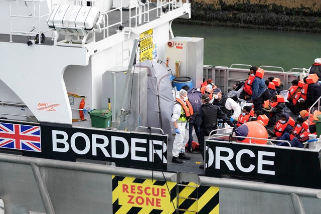<p>People thought to be migrants are brought into port after being picked up in the English Channel by a British border force vessel on 13 August</p>