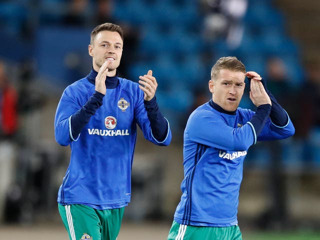 <p>Jonny Evans, pictured left, and Steven Davis are back in the Northern Ireland squad (Martin Rickett/PA)</p>