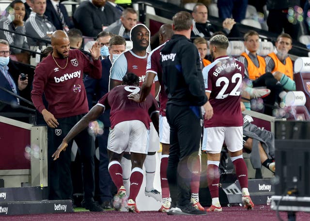 <p>Antonio heads for his cardboard cut-out (Steven Paston/PA)</p>