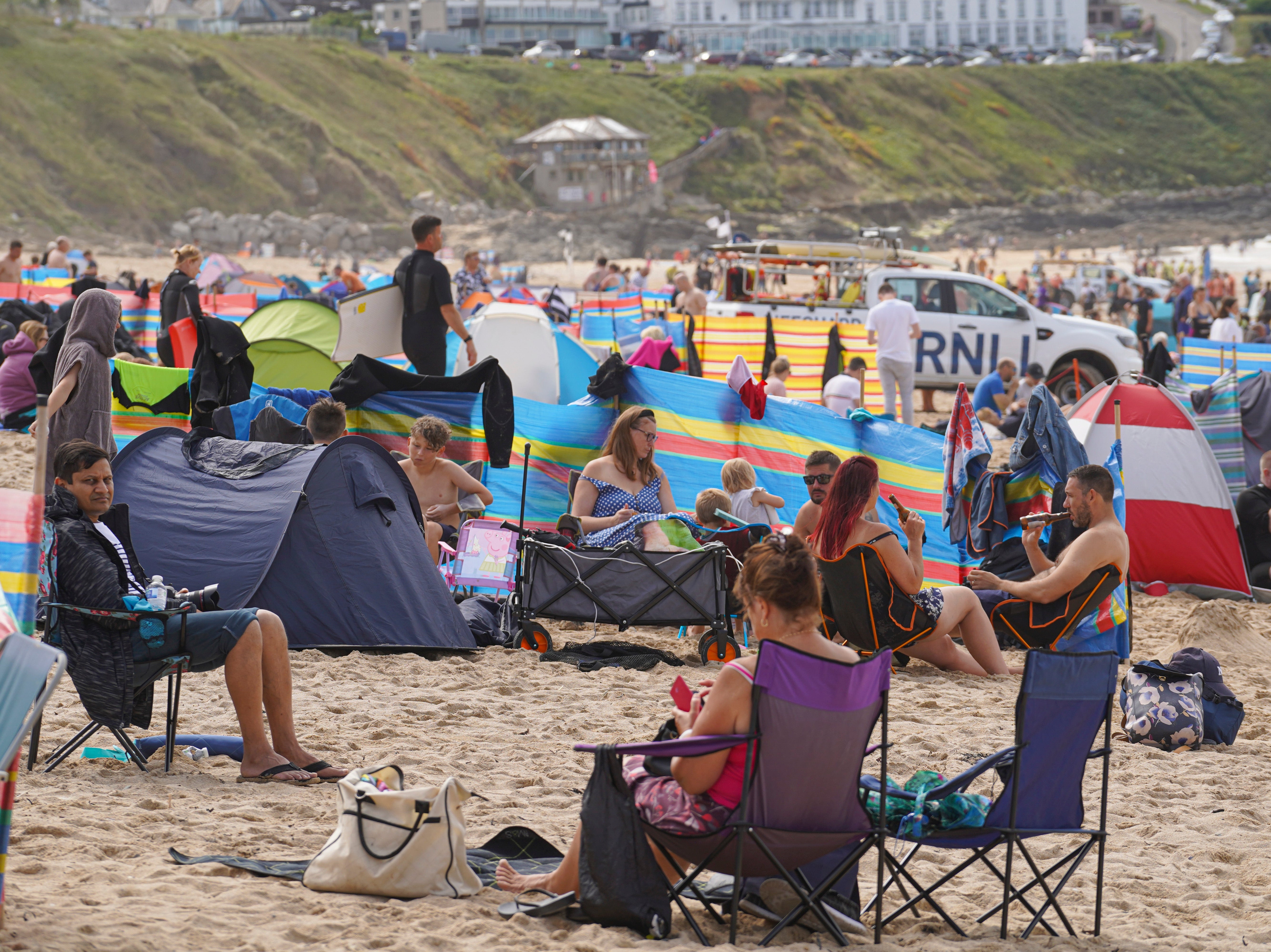 Holidaymakers on the beach in Cornwall in summer 2021