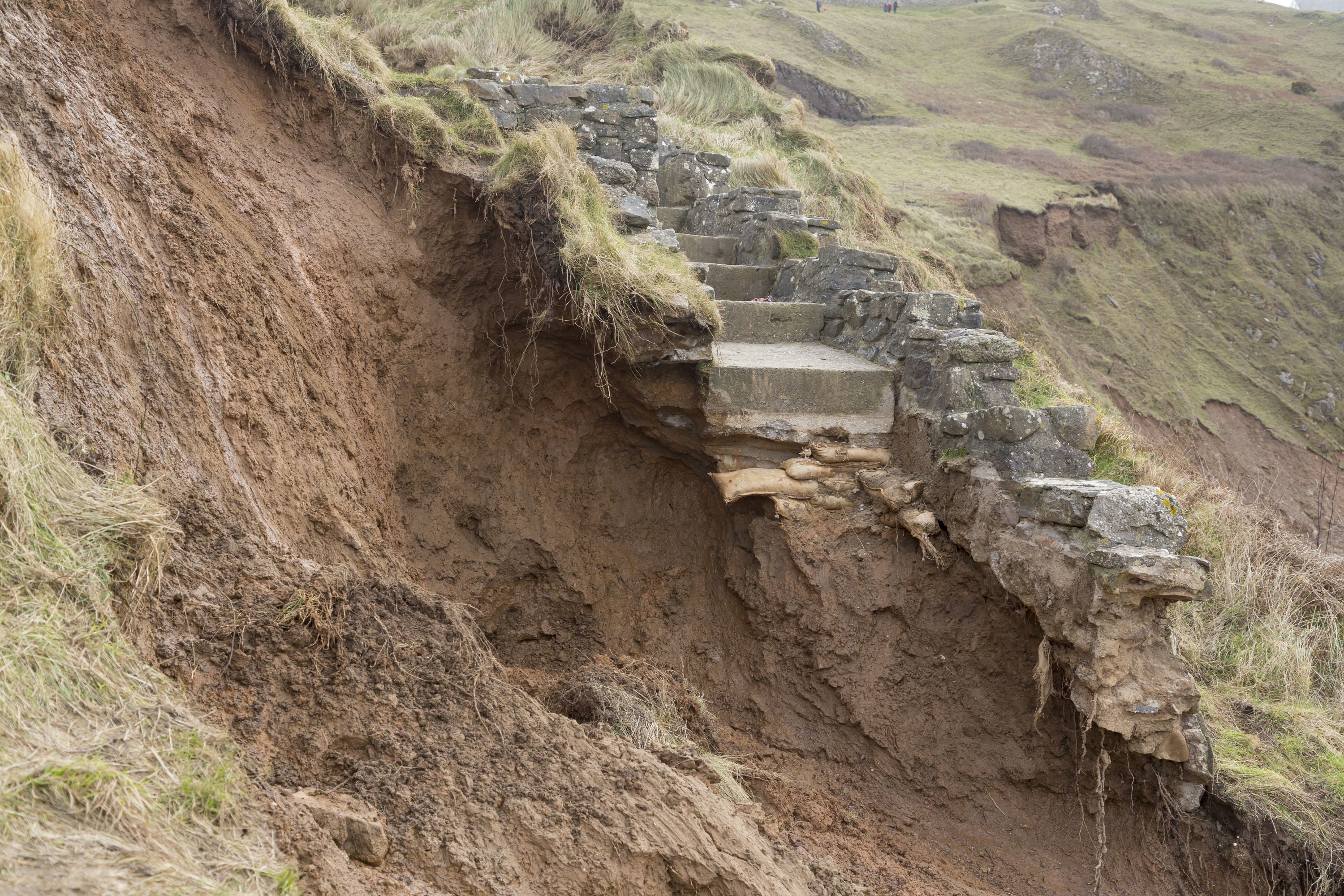 Storm-damaged cliffs and steps at Rhossili Bay, Gower, Swansea
