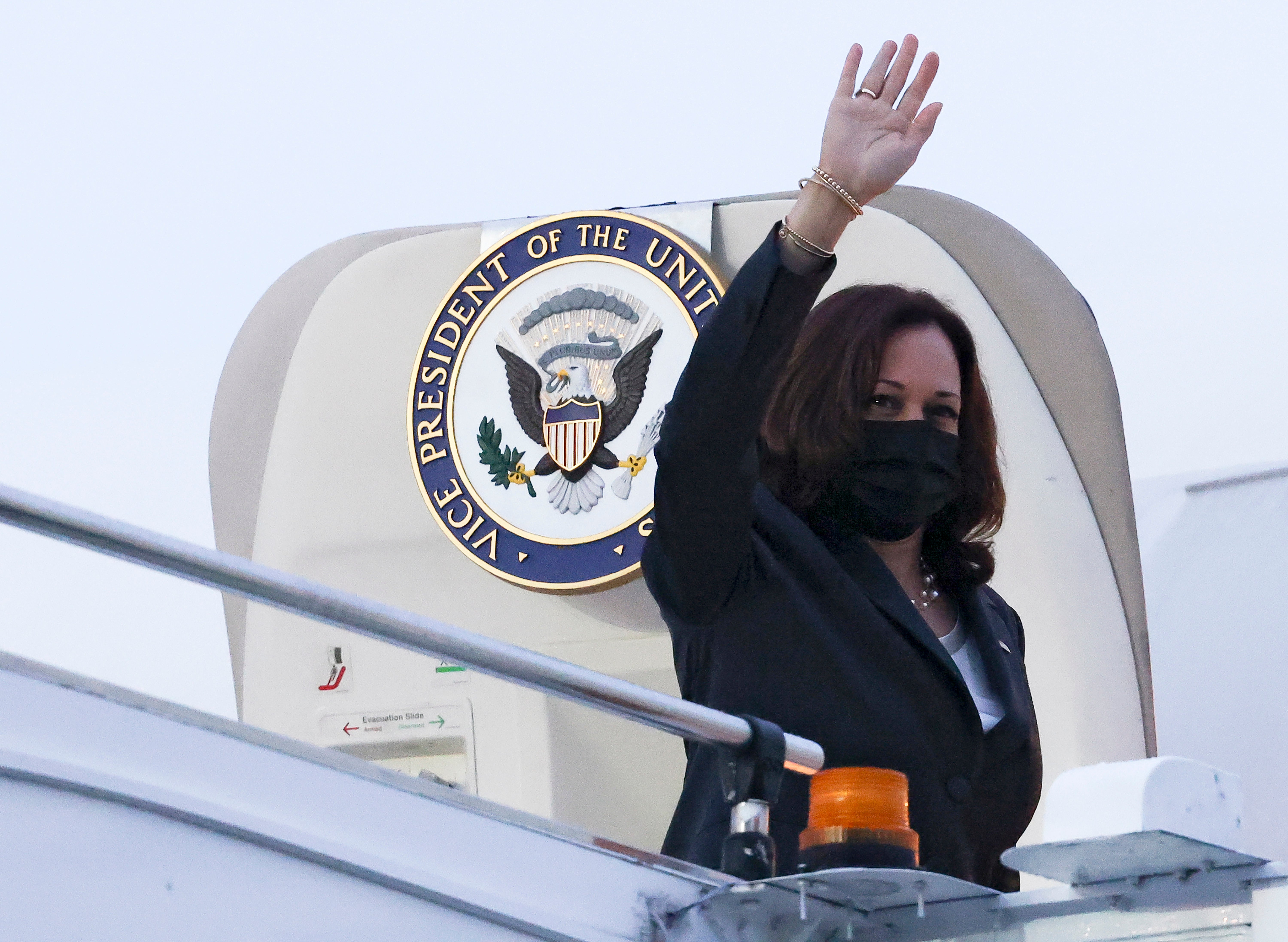 Vice President Kamala Harris waves as she departs Singapore to Vietnam on 24 August.