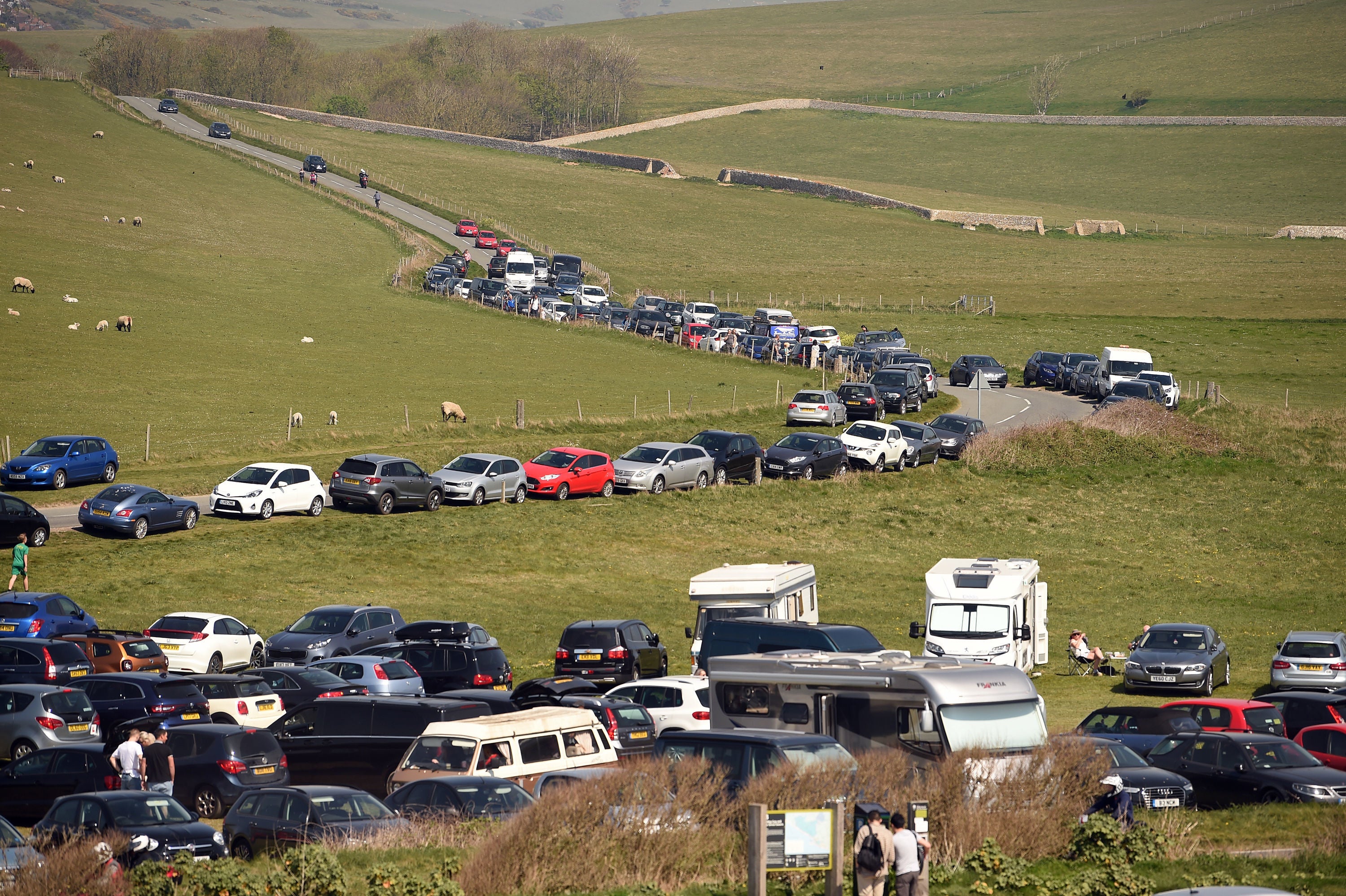 A busy car park on the cliff top during the Cadbury Easter Egg Hunt at Birling Gap