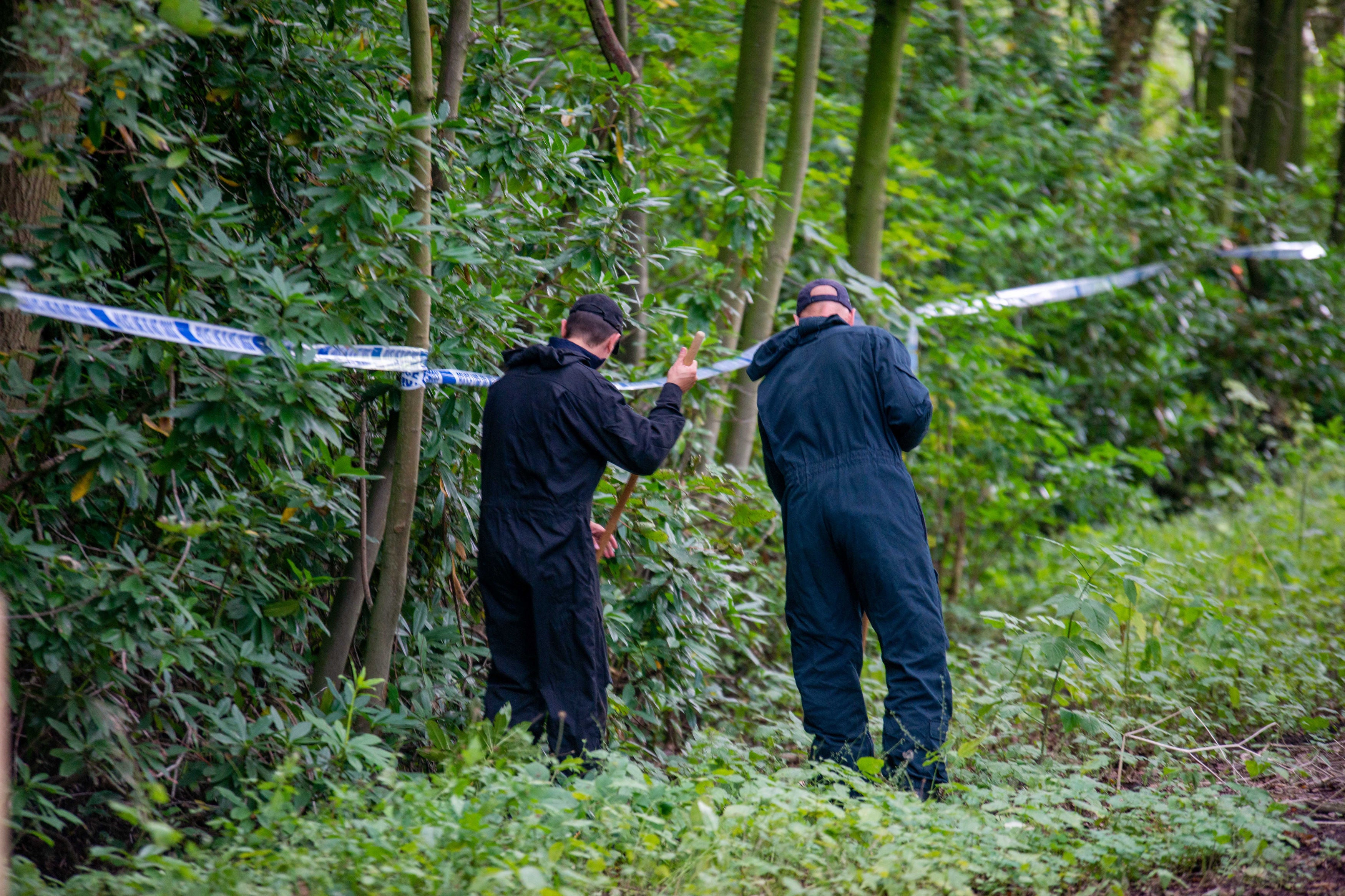 Police officers searching the land at Sand Hutton Gravel Pits near York