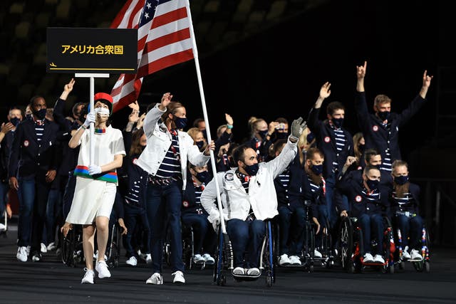 <p> Flag bearers Melissa Stockwell and Charles Aoki of Team United States lead their delegation in the parade of athletes during the opening ceremony of the Tokyo 2020 Paralympic Games at the Olympic Stadium on August 24, 2021 in Tokyo, Japan. </p>