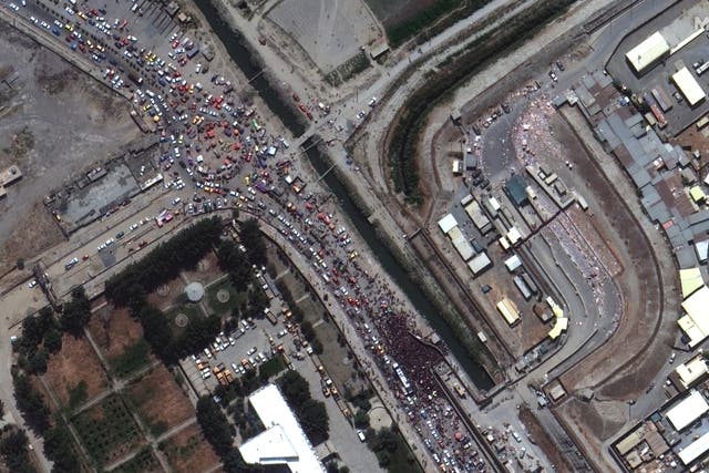 <p>A satellite image shows large crowds gathered at the northern edge of Kabul Airport in Kabul, Afghanistan, 23 August 2021</p>