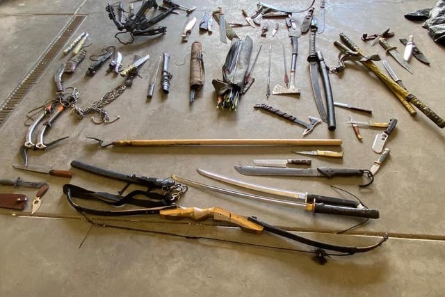 <p>A man has been arrested near a popular hiking trail in Colorado with a collection of weapons including crossbows, knives and hatchets</p>