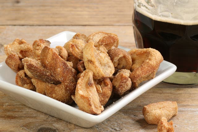 <p>Batches of pork scratchings have been linked to scores of salmonella cases in the UK</p>