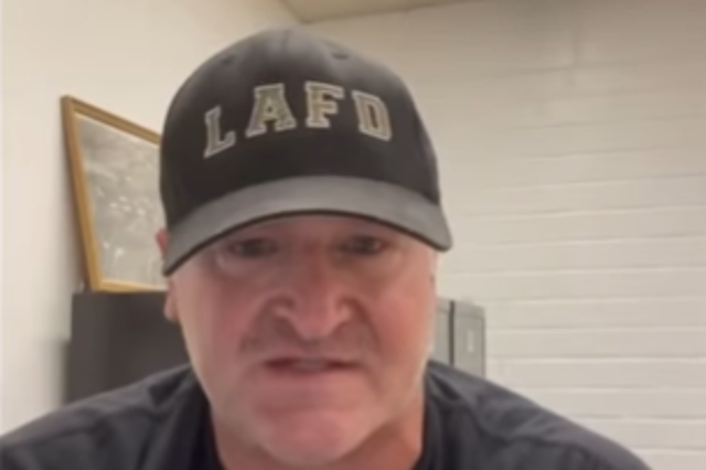 <p>A captain with the Los Angeles Fire Department, wearing an LAFD hat and shirt, has posted a 12-minute online rant calling for other first responders to “fight” against vaccine mandates</p>
